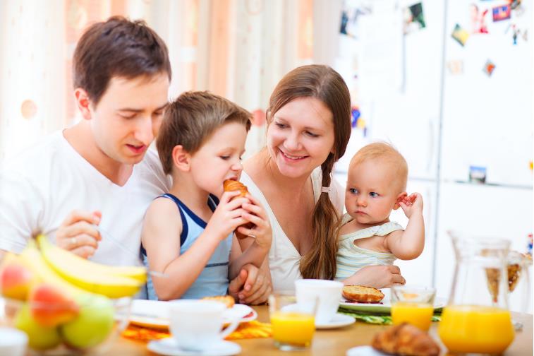 family eating breakfast at a table